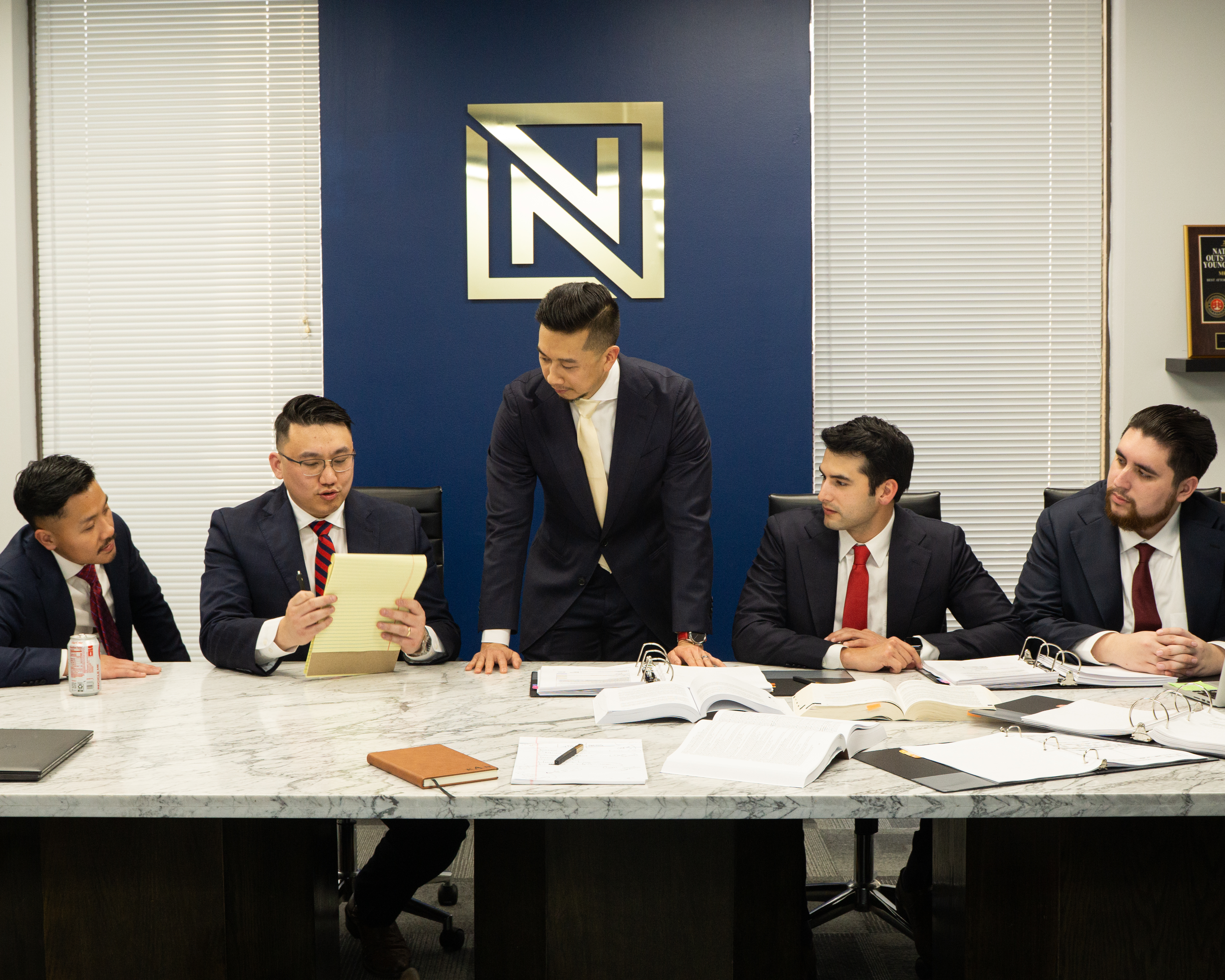 Nguyen & Associates attorneys reviewing case documents in their Houston office